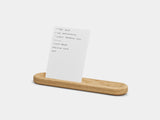 Wooden tray with a white card on a light gray background | oak