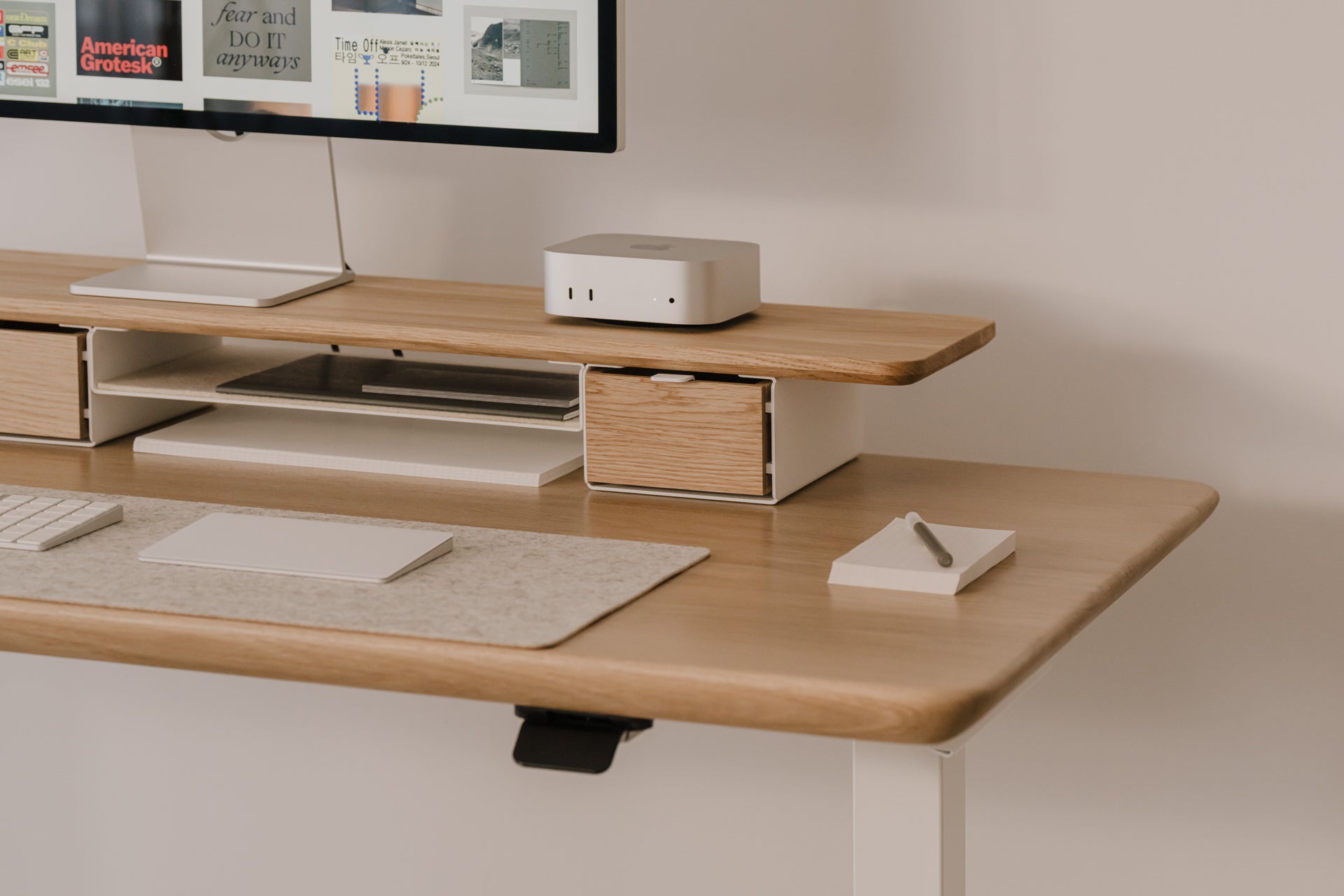 Wooden desk with Mac mini computer setup on a neutral background |light oak, , 