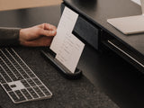 Person using an analog to-do system on a desk with a great setup keyboard and computer mouse. |-
