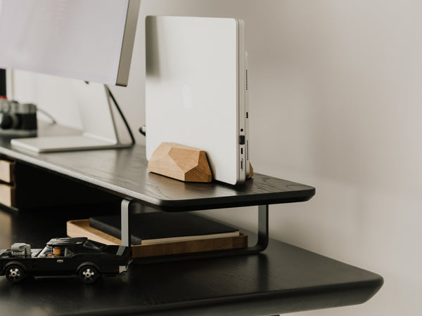 side view of black wooden desk shelf with additional accessories | black,