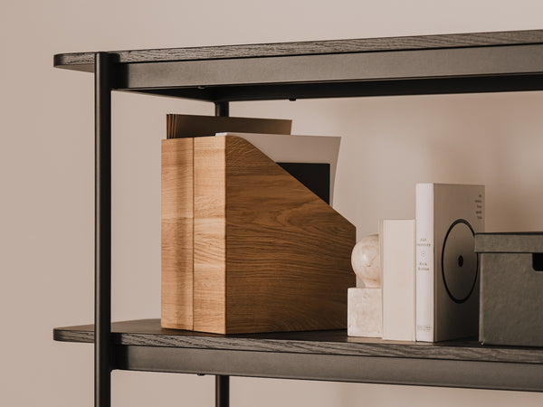 Bookshelf with A4 document holder, books and decorative items against a beige wall | oak