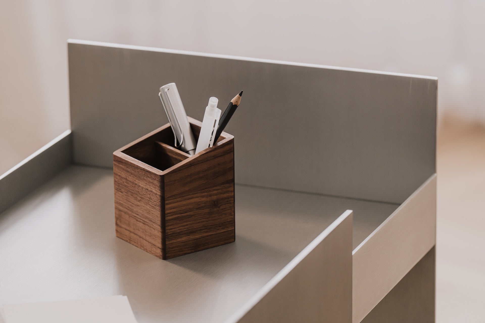 Wooden pen holder with stationery items on a desk  | walnut