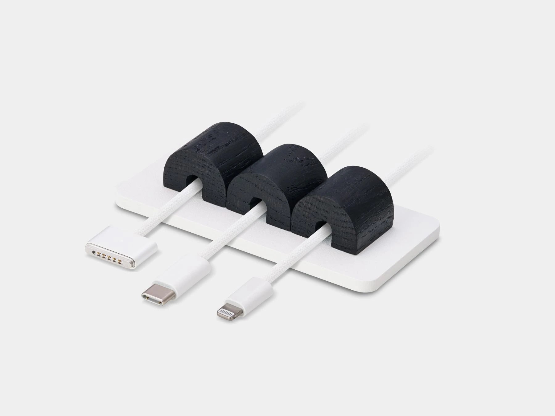 Magnetic cable organizer in black and white – stylish desktop accessory for tidy cable storage | black, white