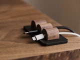 Wooden cable management system on a wooden surface | walnut, 
